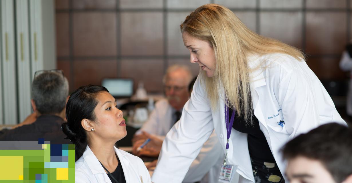 faculty members discuss a patient's medications