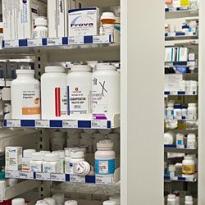 prescription medications on shelves in pharmacy