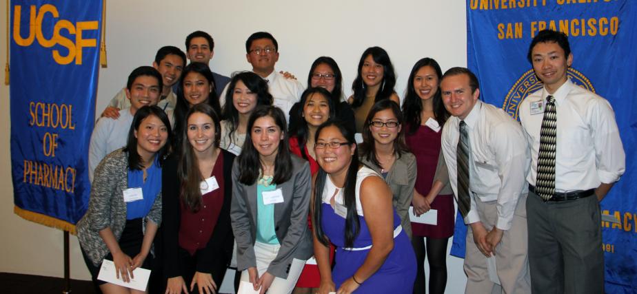 student pharmacists with banners