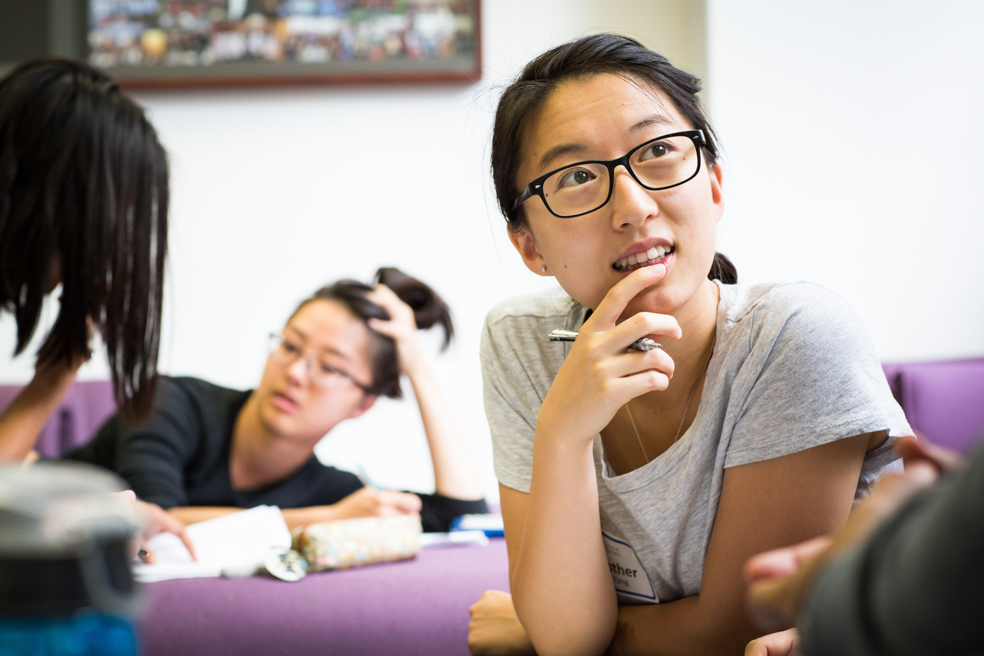 Student listening thoughtfully in seminar room