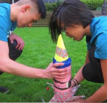 camp counselors with bottle rocket