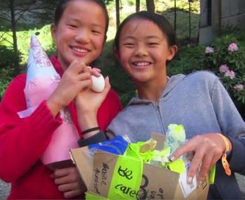 two girls at Science Camp holding an egg
