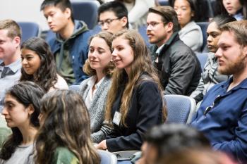 Berkley seated among other students