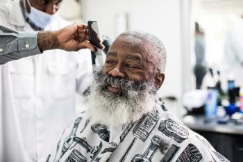 Dixon receiving a beard trim