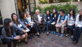 Levin chatting with students.