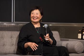 Koda-Kimble holding a microphone