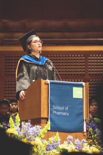 Kenkare-Mitra at podium.